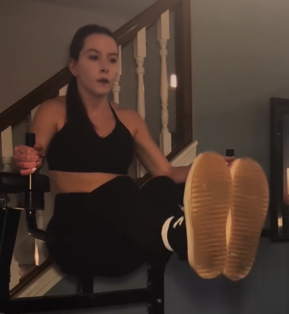 Athlete performing leg raises on gym equipment
